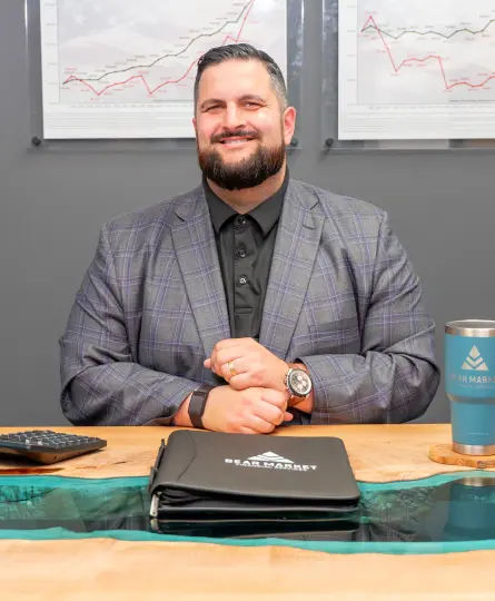 Curtis James behind desk